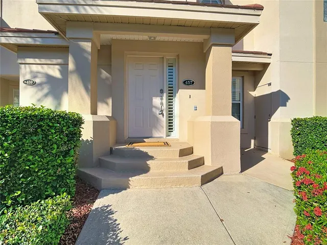 a kitchen with stainless steel appliances granite countertop a refrigerator sink and cabinets