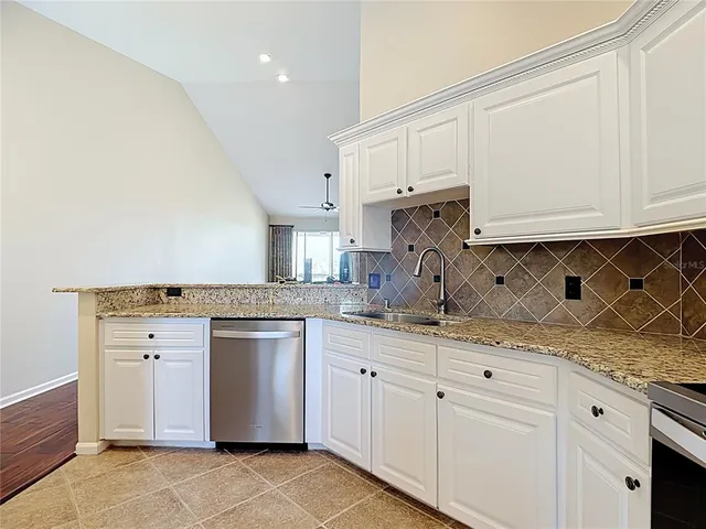a kitchen with a refrigerator sink and microwave