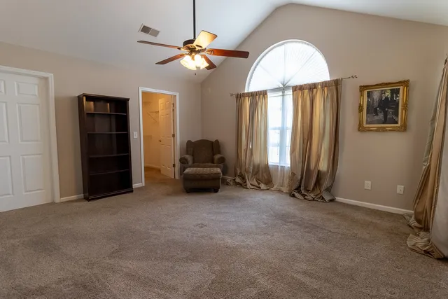 a view of a livingroom with furniture and a chandelier