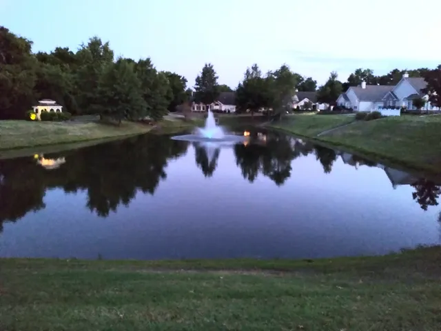 an aerial view of residential house with outdoor space and lake view