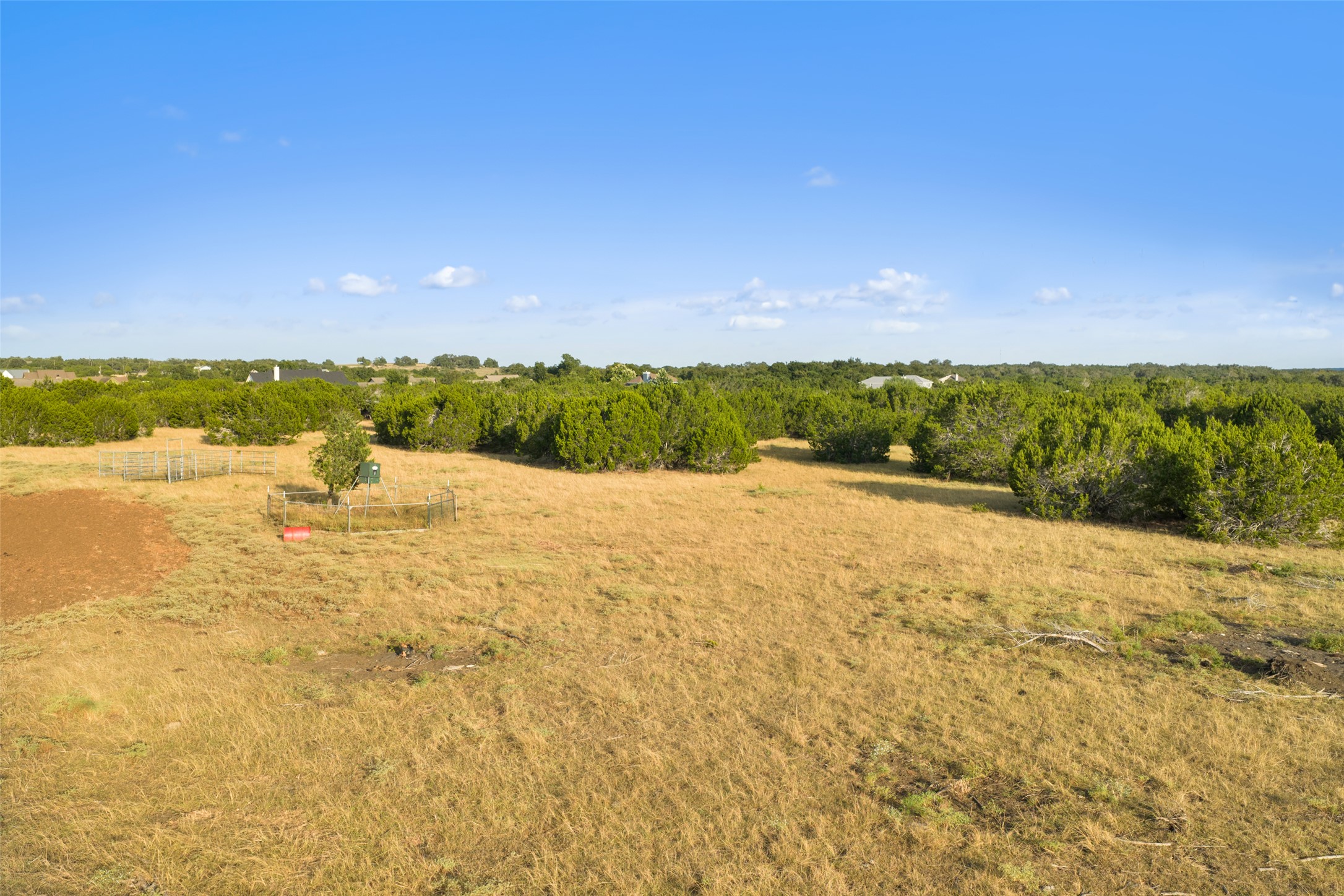 0 Hays Country Acres Road Dripping Springs, TX 78620 - Photo 18 of 33 Natural greenery and wide open spaces define this expansive countryside acreage under clear blue skies.