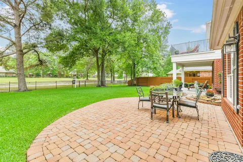 a view of a backyard with sitting area
