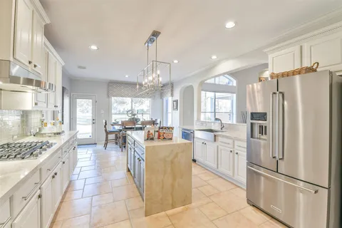 a kitchen with counter top space appliances and cabinets