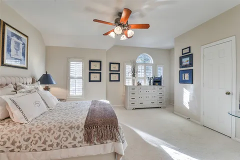 a bedroom with a bed and a couch
