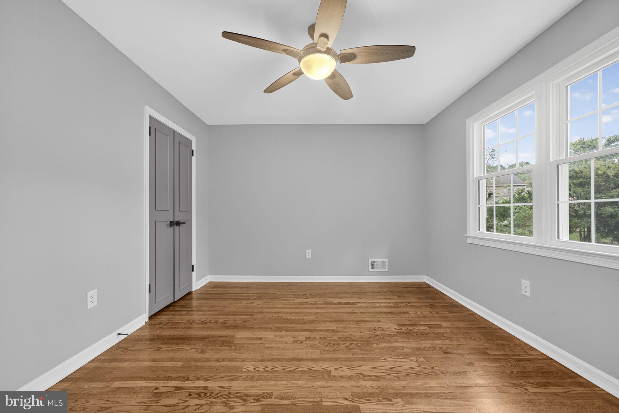 7009 Cold Spring Lane Alexandria, VA 22306 - Photo 14 of 30 wooden floor in an empty room with a window