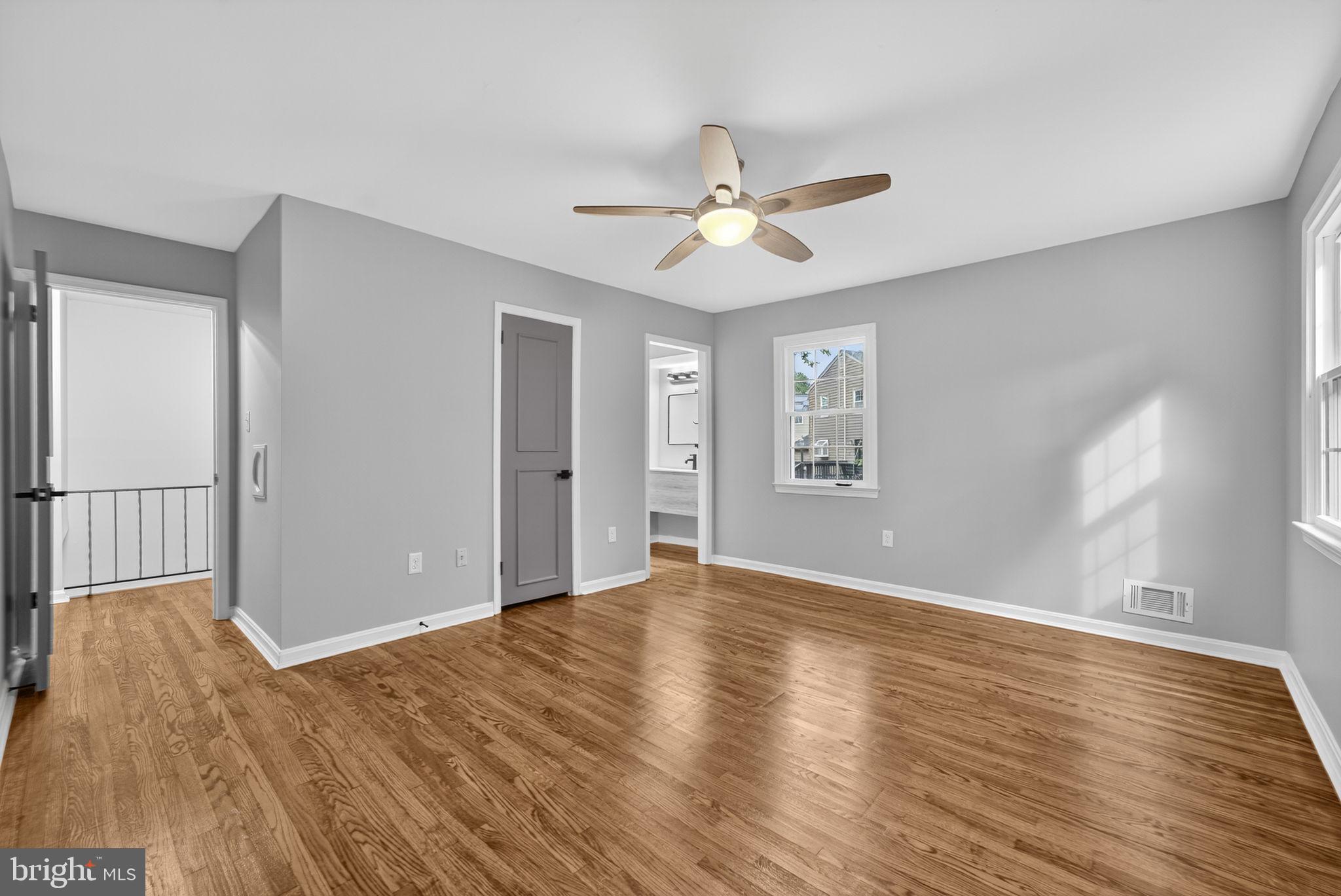 7009 Cold Spring Lane Alexandria, VA 22306 - Photo 15 of 30 a view of an empty room with wooden floor and a window
