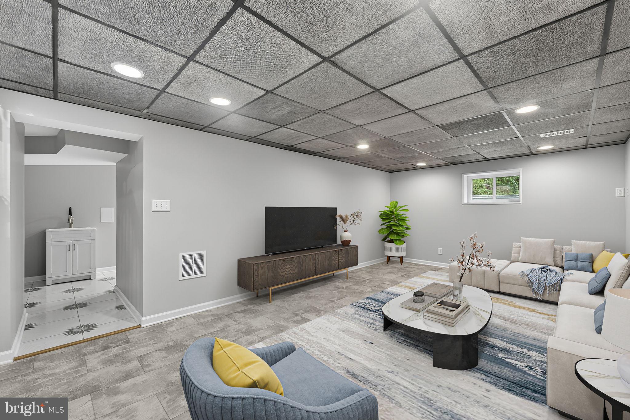7009 Cold Spring Lane Alexandria, VA 22306 - Photo 22 of 30 a living room with furniture and a flat screen tv
