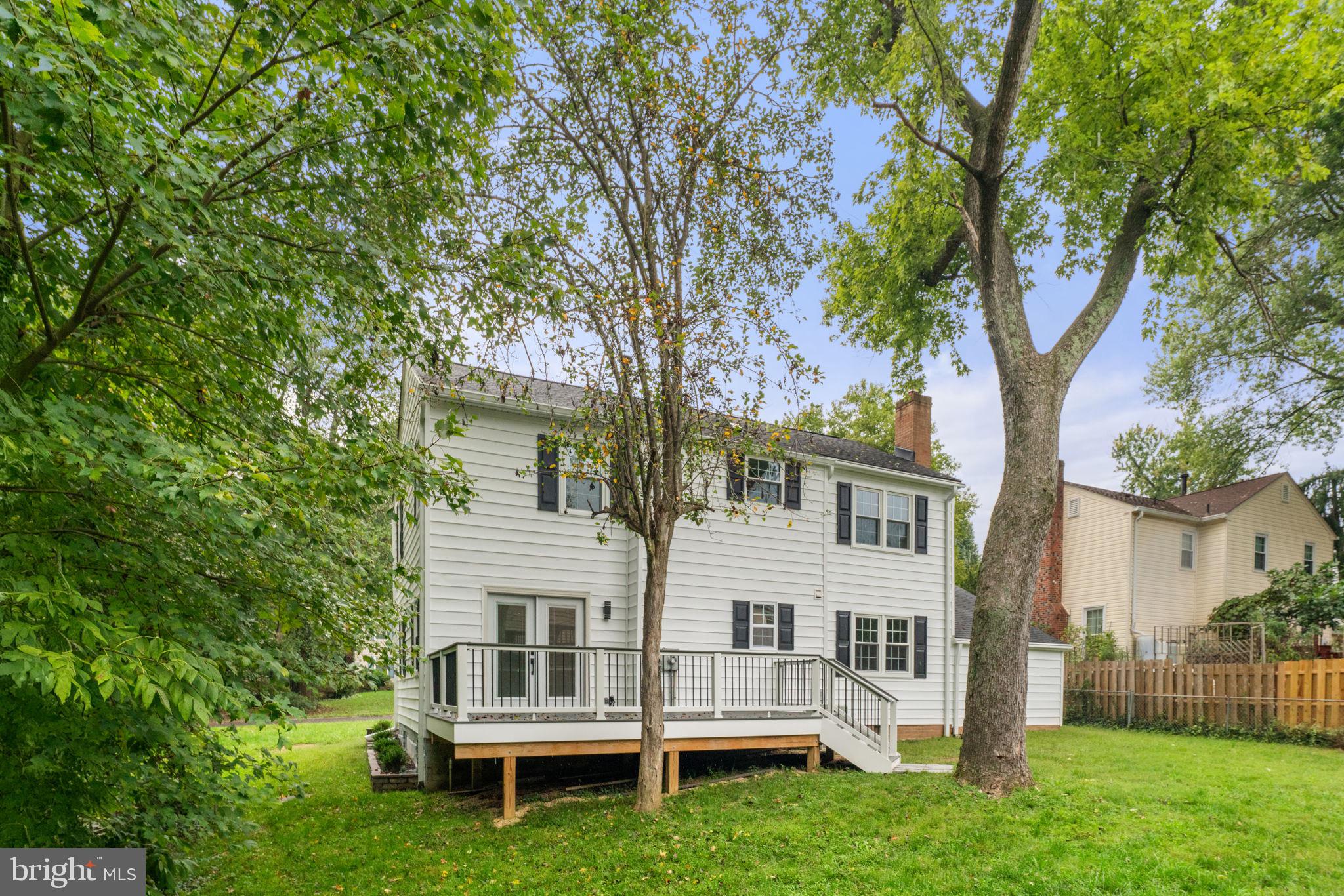 7009 Cold Spring Lane Alexandria, VA 22306 - Photo 28 of 30 a white house that has a tree in front of a house