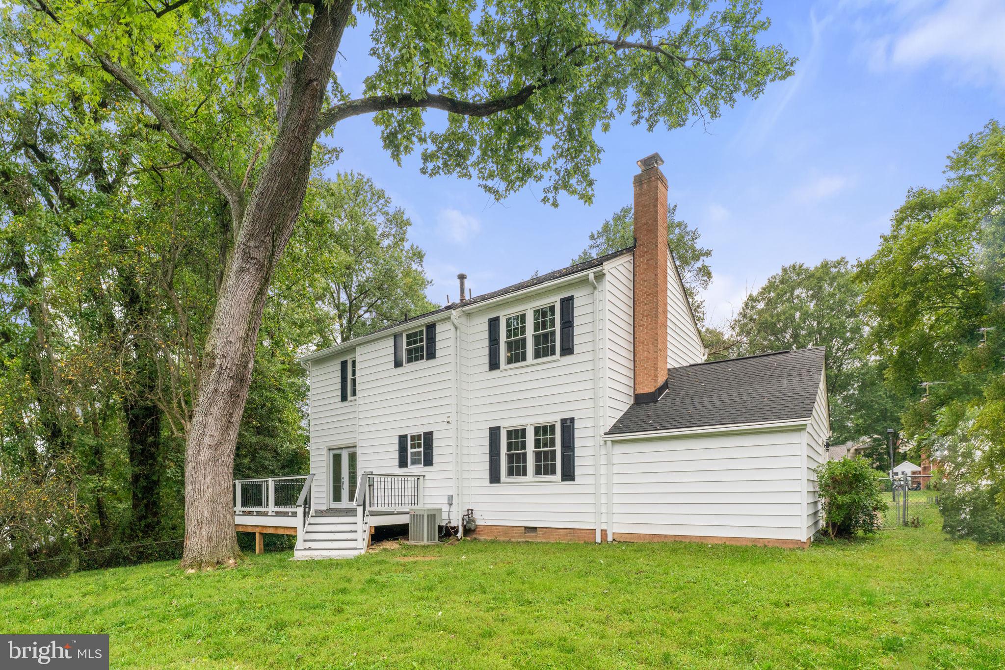 7009 Cold Spring Lane Alexandria, VA 22306 - Photo 29 of 30 a front view of a house with a garden
