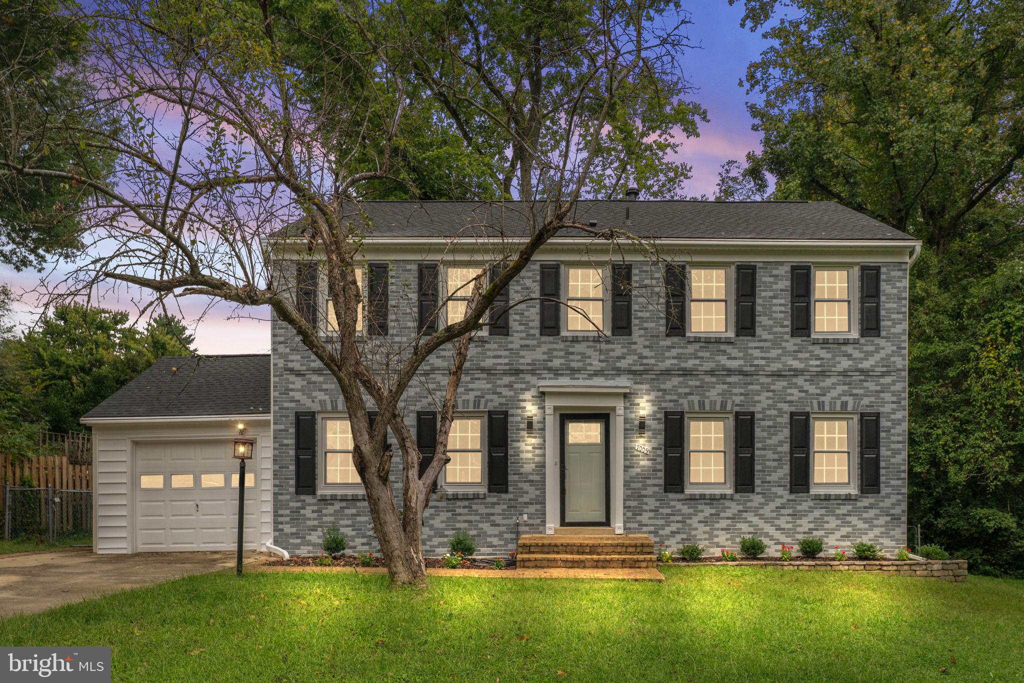 7009 Cold Spring Lane Alexandria, VA 22306 - Photo 30 of 30 a front view of a house with a yard