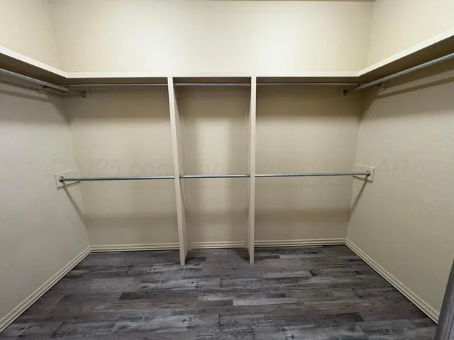 a view of an empty walk in closet
