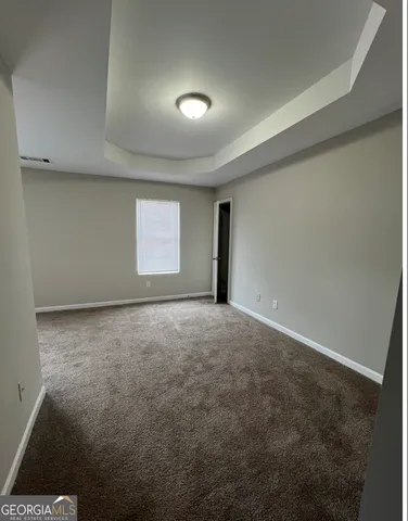 an empty room with a empty space and window