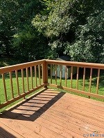 4418 Bridgewood Road Midlothian, VA 23112 - Photo 6 of 6 Wood-finish deck with a wood railing and a storage