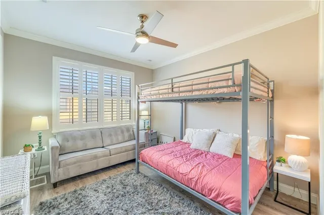 a bedroom with a bed couch and window