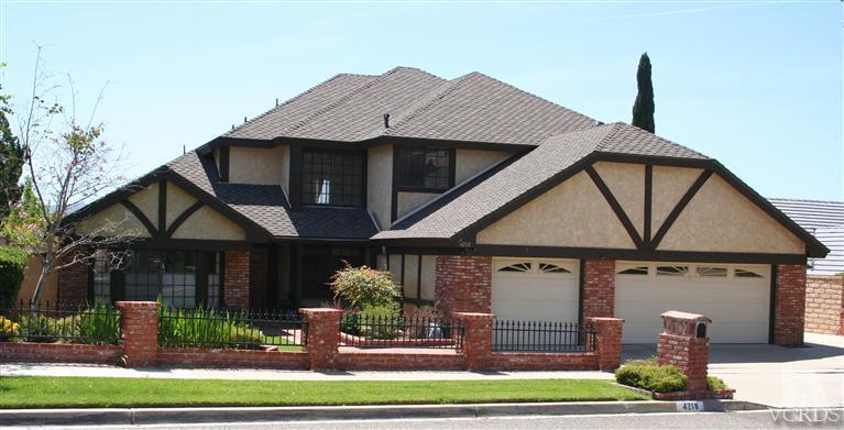 4218 Roxbury Street Simi Valley, CA 93063 - Photo 1 of 30 a front view of a house with garden