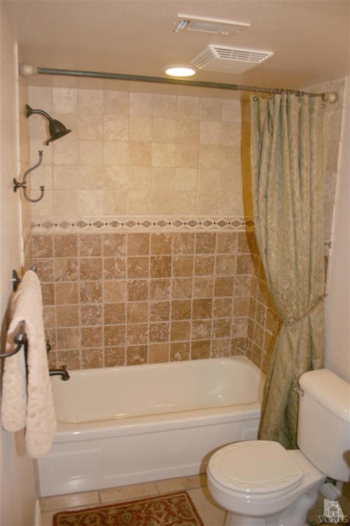 4218 Roxbury Street Simi Valley, CA 93063 - Photo 14 of 30 a bathroom with a toilet a sink and bathtub
