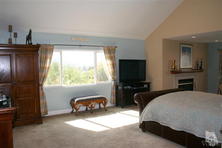 4218 Roxbury Street Simi Valley, CA 93063 - Photo 16 of 30 a living room with furniture a flat screen tv and a window
