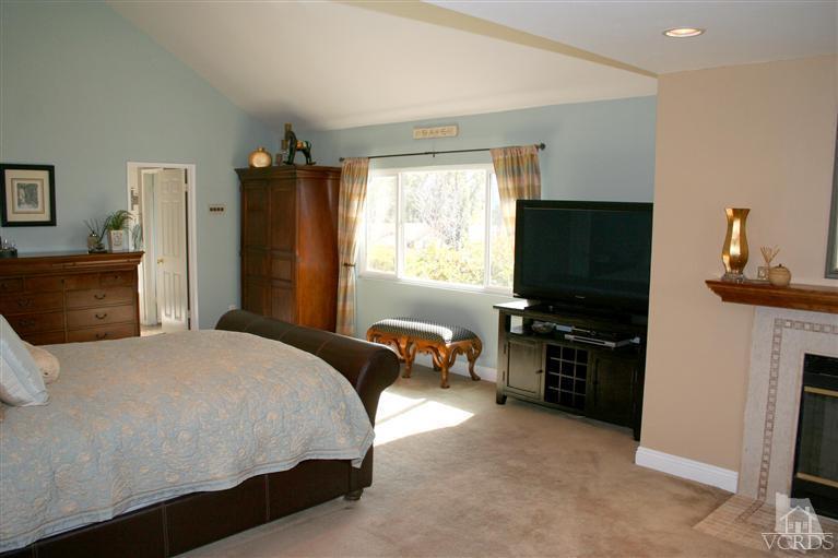 4218 Roxbury Street Simi Valley, CA 93063 - Photo 18 of 30 a bedroom with a bed and flat screen tv