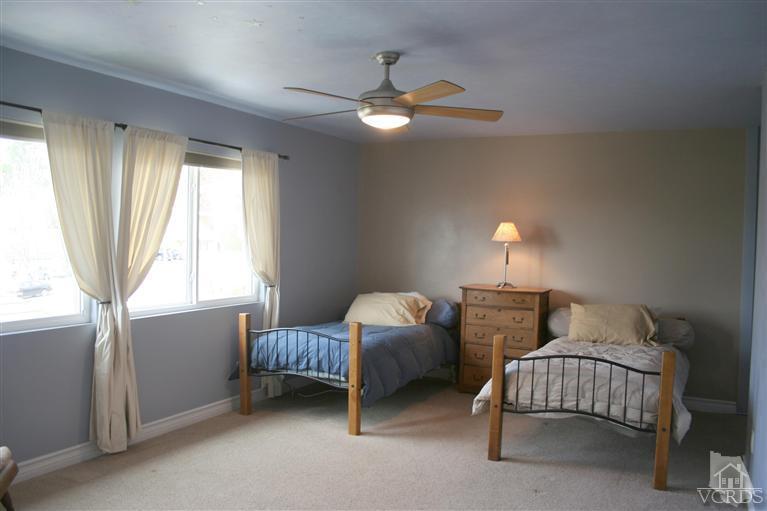 4218 Roxbury Street Simi Valley, CA 93063 - Photo 22 of 30 a bedroom with a bed and a window