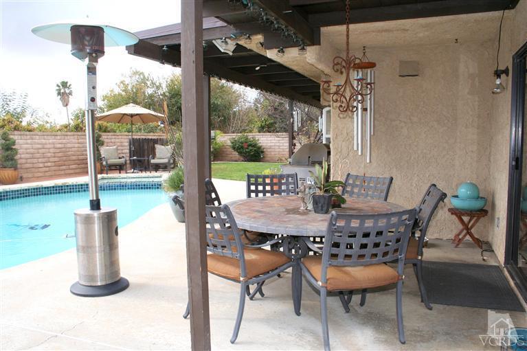 4218 Roxbury Street Simi Valley, CA 93063 - Photo 25 of 30 a dining room with furniture and a floor to ceiling window