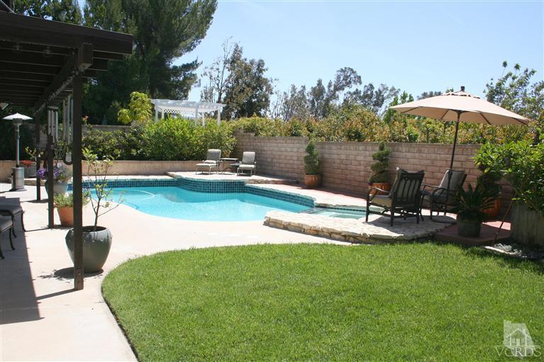 4218 Roxbury Street Simi Valley, CA 93063 - Photo 27 of 30 a view of a garden with a slide and potted plants