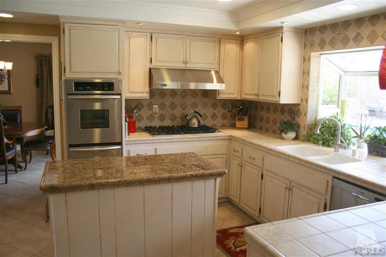 4218 Roxbury Street Simi Valley, CA 93063 - Photo 6 of 30 a kitchen with stainless steel appliances granite countertop a sink stove and refrigerator