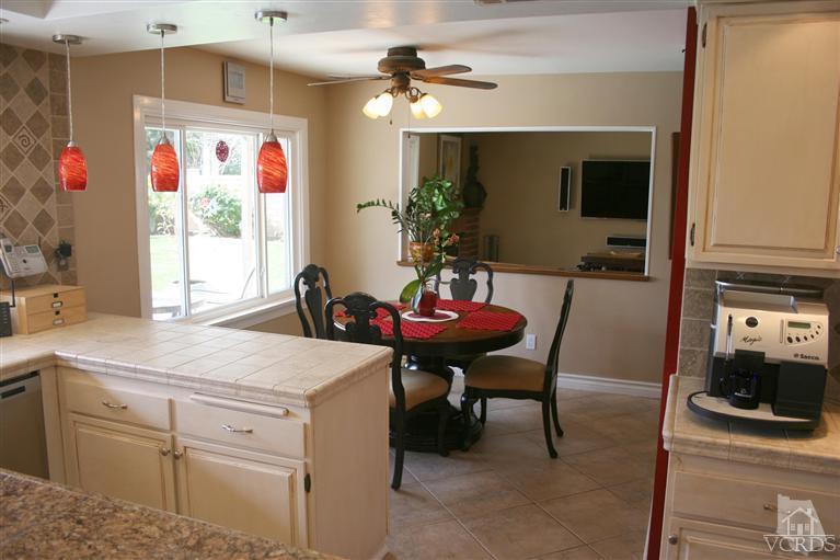 4218 Roxbury Street Simi Valley, CA 93063 - Photo 8 of 30 a kitchen with a sink cabinets and dining table