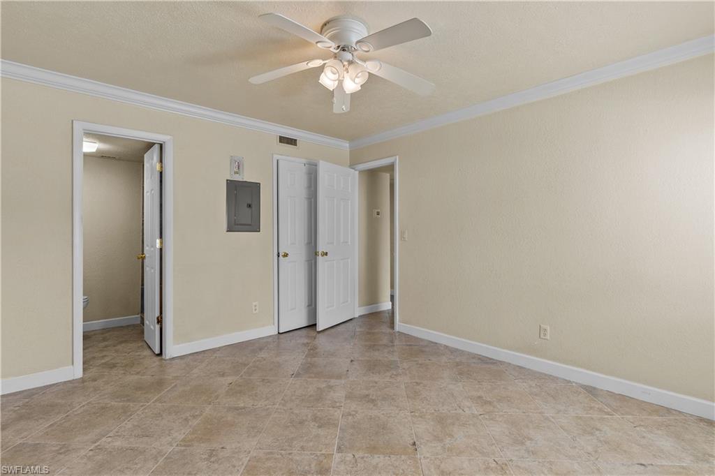 4615 Bayshore Drive, Unit E4 Naples, FL 34112 - Photo 13 of 30 wooden floor in an empty room