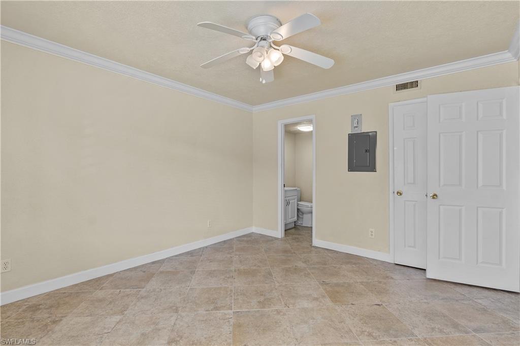 4615 Bayshore Drive, Unit E4 Naples, FL 34112 - Photo 21 of 30 wooden floor in an empty room