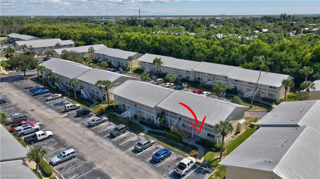 4615 Bayshore Drive, Unit E4 Naples, FL 34112 - Photo 23 of 30 an aerial view of a city