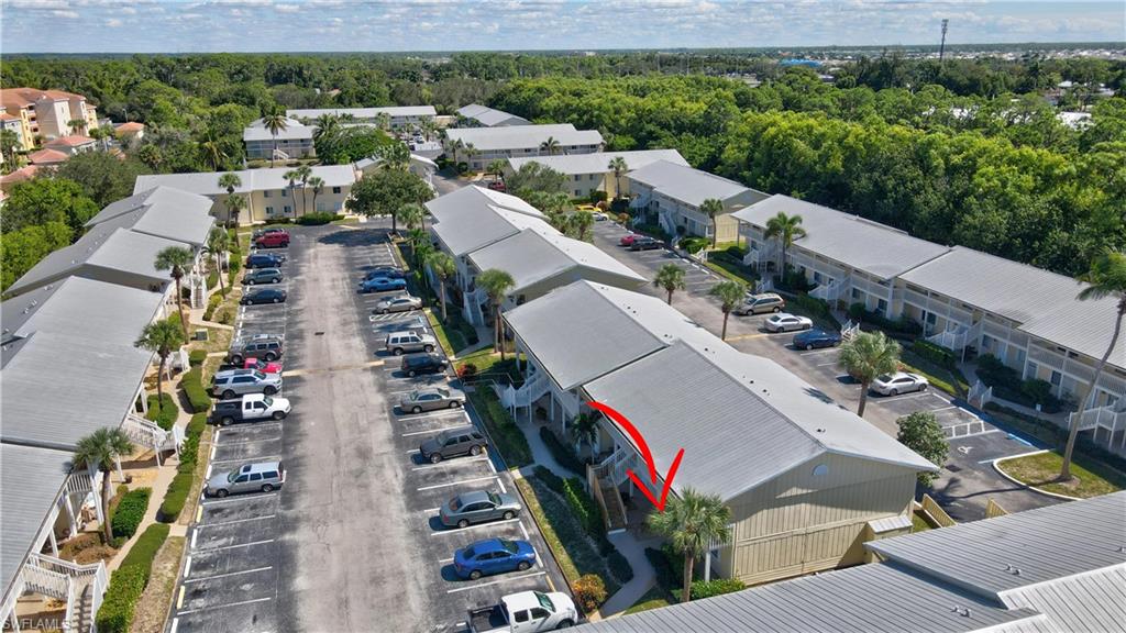 4615 Bayshore Drive, Unit E4 Naples, FL 34112 - Photo 24 of 30 an aerial view of residential houses with outdoor space