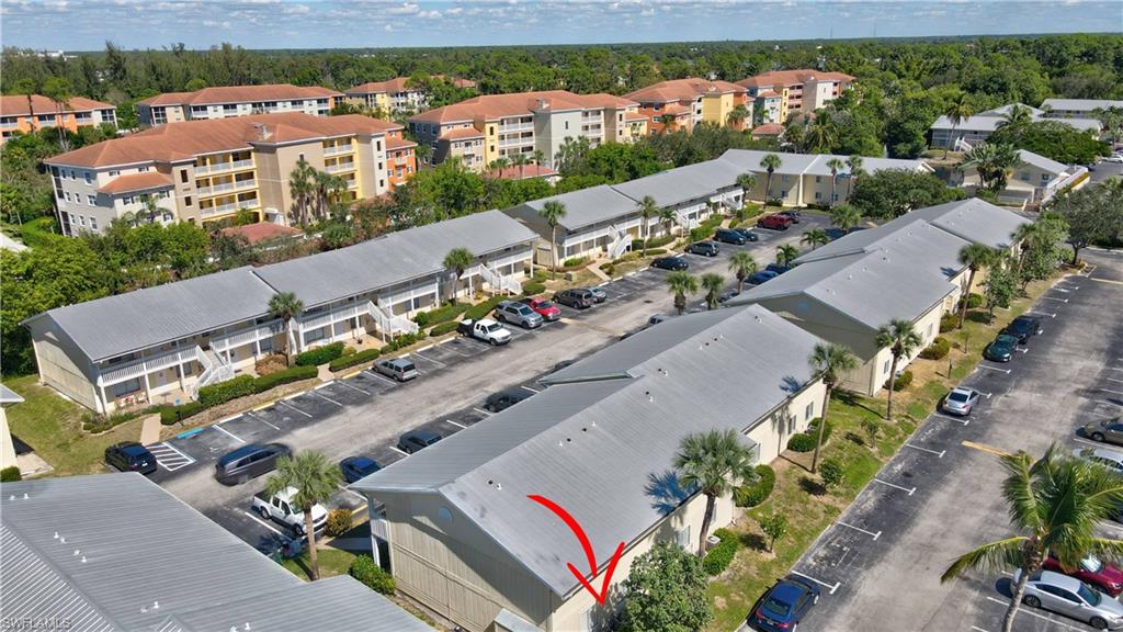 4615 Bayshore Drive, Unit E4 Naples, FL 34112 - Photo 25 of 30 an aerial view of a city
