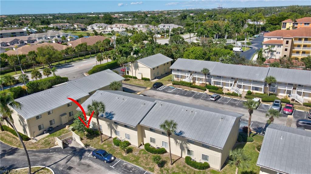 4615 Bayshore Drive, Unit E4 Naples, FL 34112 - Photo 26 of 30 an aerial view of a house with a garden