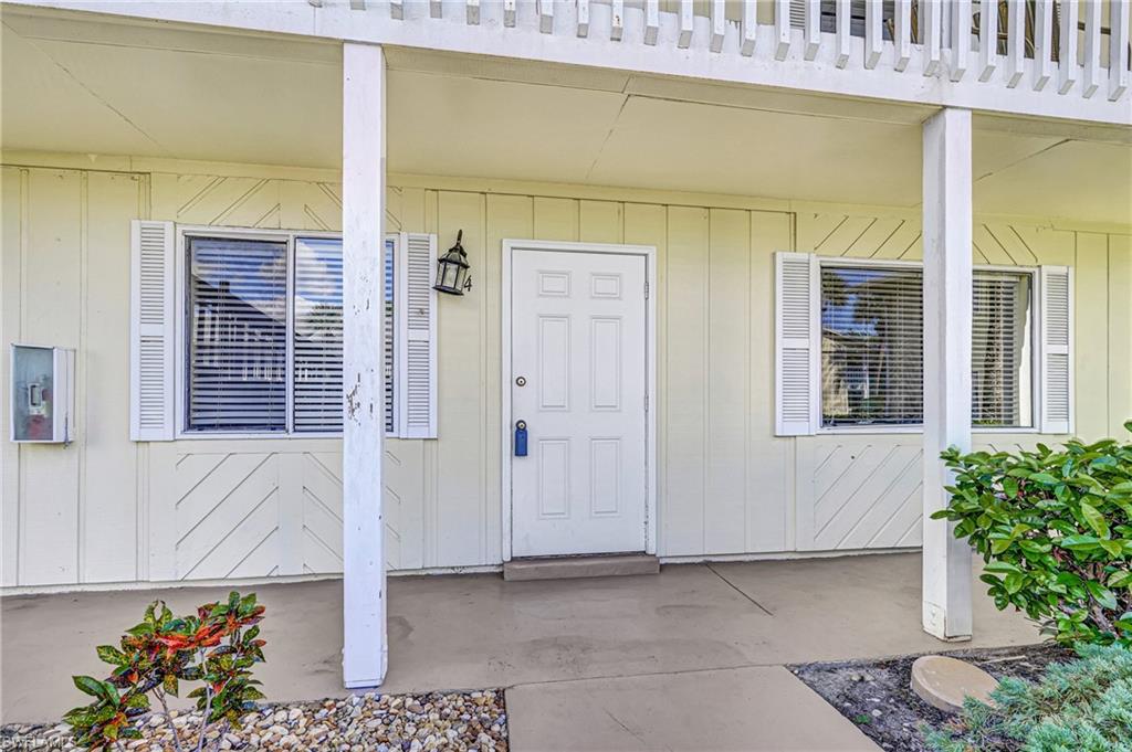 4615 Bayshore Drive, Unit E4 Naples, FL 34112 - Photo 27 of 30 a front view of a house