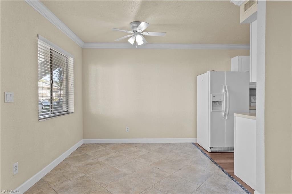4615 Bayshore Drive, Unit E4 Naples, FL 34112 - Photo 3 of 30 a view of an empty room with a window