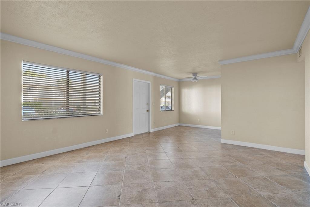 4615 Bayshore Drive, Unit E4 Naples, FL 34112 - Photo 8 of 30 a view of an empty room with a window