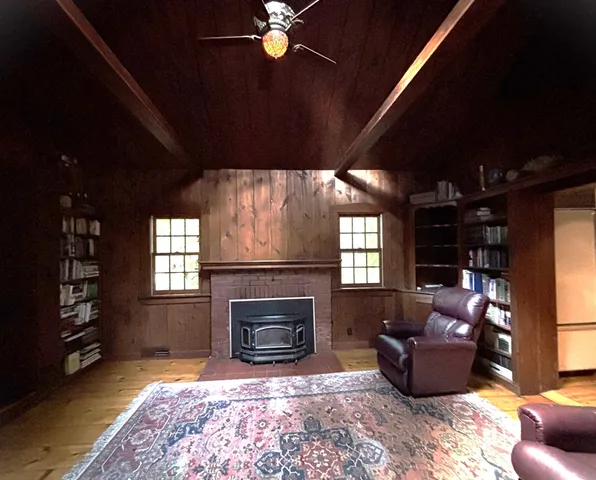 a view of a large swimming pool with a table and chairs