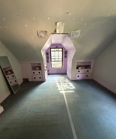 a view of a backyard with large trees