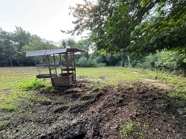 a view of house with roof deck and sink