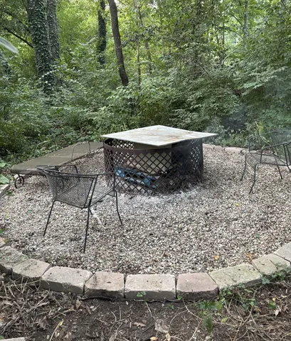 a view of room with window and wooden floor