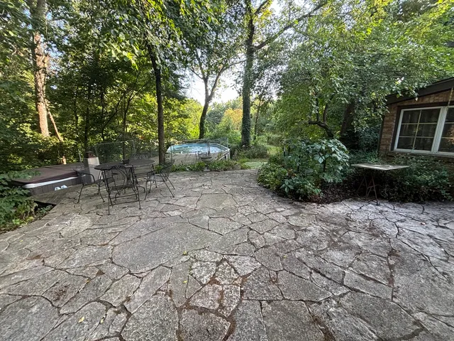 a kitchen with a sink a stove and cabinets