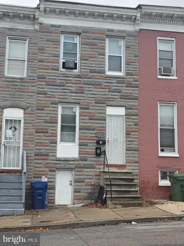 a view of a brick house with a large windows