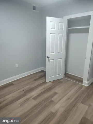 a kitchen with granite countertop a sink and a stove
