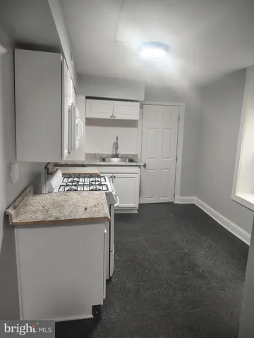 a view of wooden floor and windows in a room
