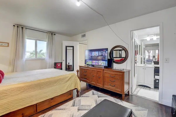 a bedroom with a bed and window