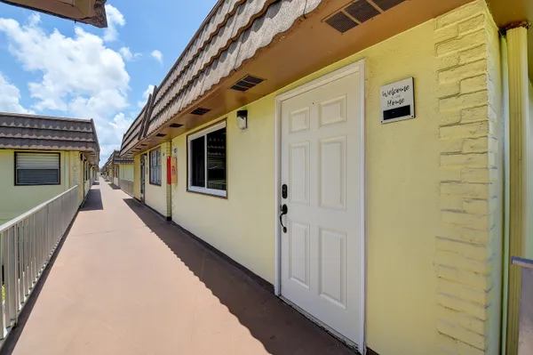 a view of a house with a yard from a balcony
