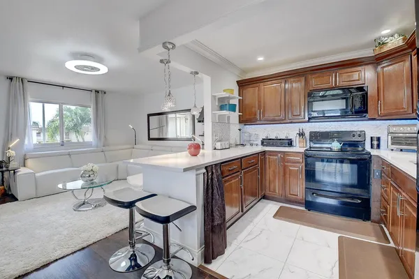 a kitchen with sink cabinets and window