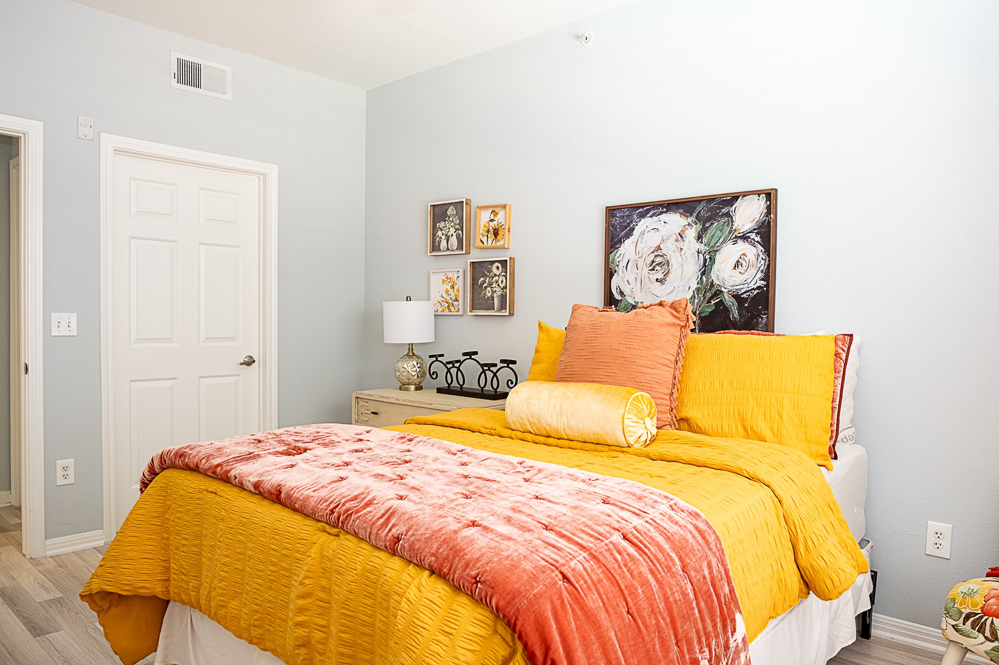 2502 Leon Street, Unit 309 Austin, TX 78705 - Photo 10 of 19 a bedroom with a bed and painting on the wall