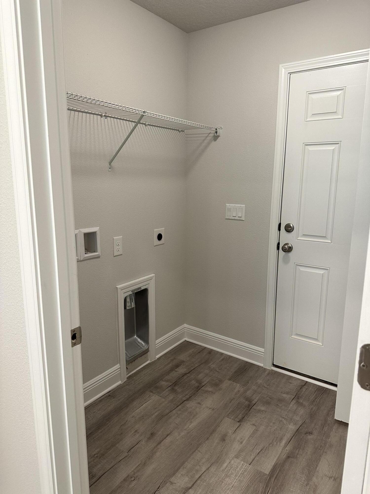 5287 Hidden Pines Circle Milton, FL 32583 - Photo 8 of 15 a view of an empty room with wooden floor and a window
