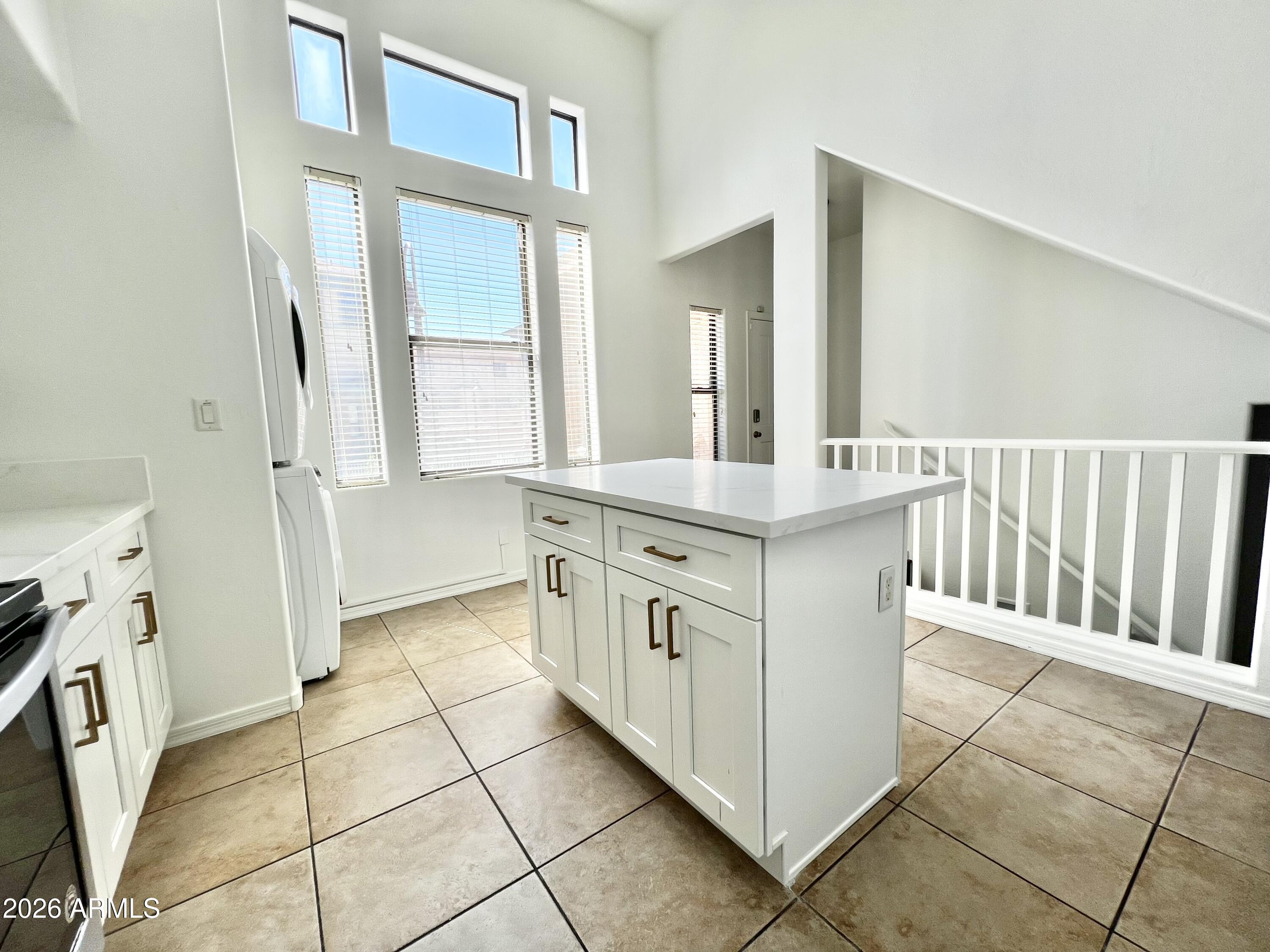 730 South Beck Avenue Tempe, AZ 85281 - Photo 12 of 29 a kitchen with a sink stove and cabinets